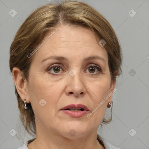 Joyful white adult female with medium  brown hair and grey eyes