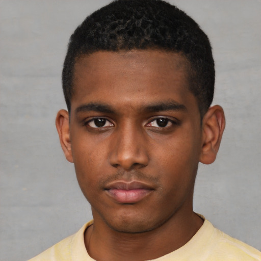Neutral black young-adult male with short  black hair and brown eyes