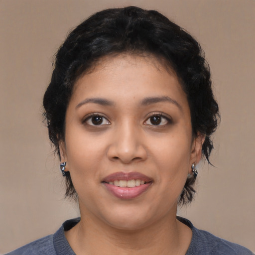 Joyful latino young-adult female with medium  black hair and brown eyes
