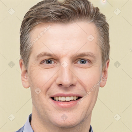 Joyful white adult male with short  brown hair and grey eyes