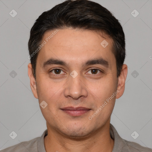 Joyful white young-adult male with short  black hair and brown eyes