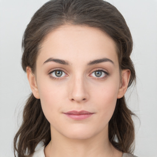 Neutral white young-adult female with medium  brown hair and brown eyes