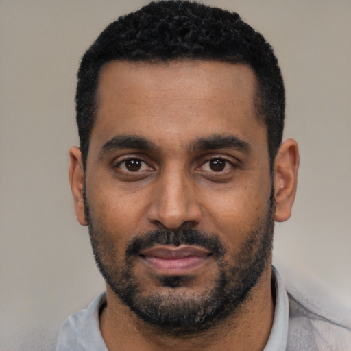 Neutral black young-adult male with short  black hair and brown eyes