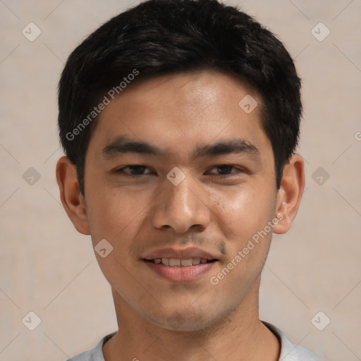 Joyful asian young-adult male with short  black hair and brown eyes