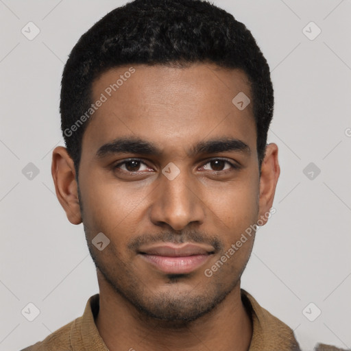 Joyful black young-adult male with short  black hair and brown eyes