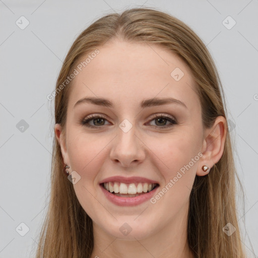 Joyful white young-adult female with long  brown hair and grey eyes