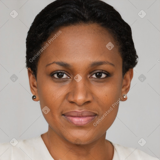 Joyful black young-adult female with short  black hair and brown eyes