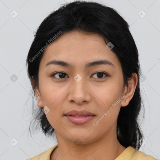 Joyful latino young-adult female with medium  brown hair and brown eyes