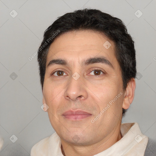 Joyful white adult male with short  black hair and brown eyes