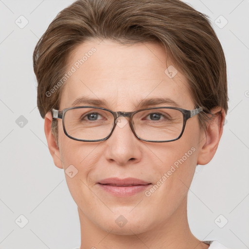 Joyful white adult female with short  brown hair and grey eyes