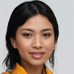 Joyful asian young-adult female with medium  black hair and brown eyes