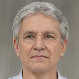 Neutral white middle-aged male with short  gray hair and brown eyes