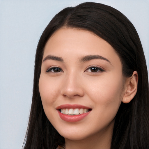 Joyful white young-adult female with long  black hair and brown eyes