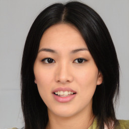 Joyful asian young-adult female with medium  black hair and brown eyes