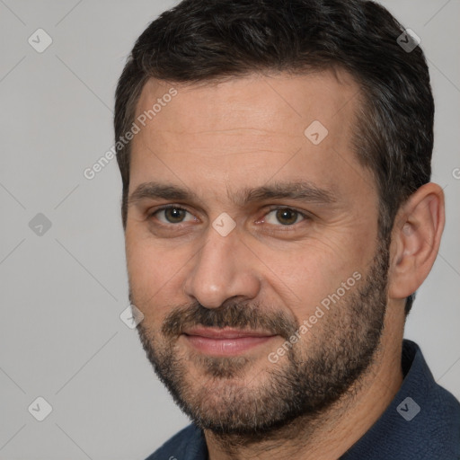 Joyful white adult male with short  brown hair and brown eyes