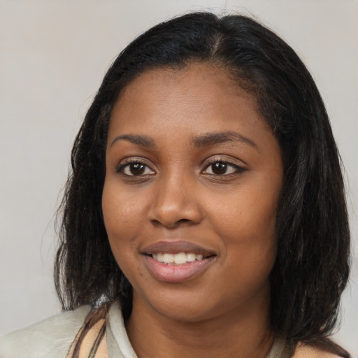 Joyful latino young-adult female with long  brown hair and brown eyes