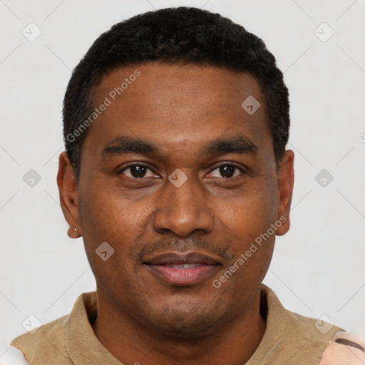 Joyful black young-adult male with short  black hair and brown eyes