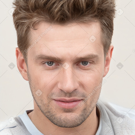 Joyful white adult male with short  brown hair and grey eyes