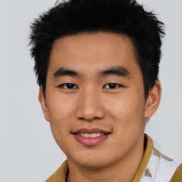 Joyful asian young-adult male with short  black hair and brown eyes