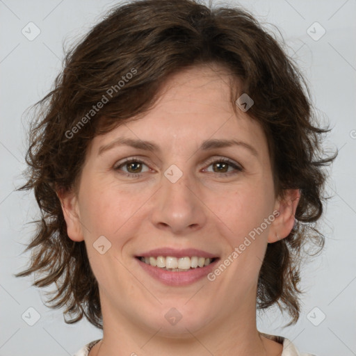 Joyful white young-adult female with medium  brown hair and green eyes