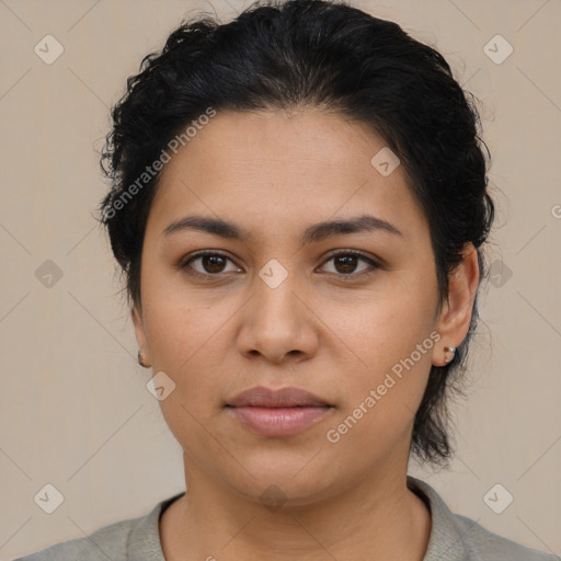 Joyful latino young-adult female with short  brown hair and brown eyes