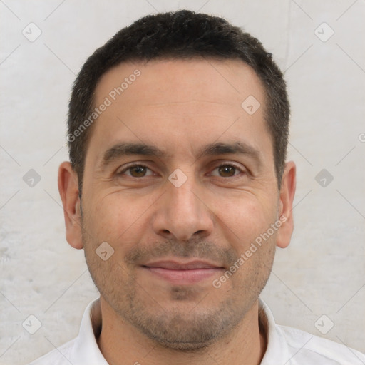 Joyful white adult male with short  brown hair and brown eyes