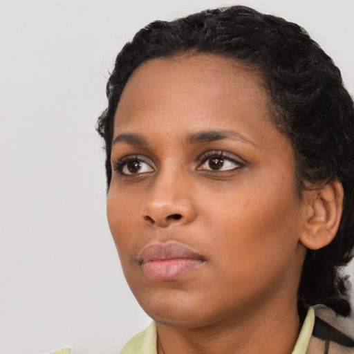 Neutral black young-adult female with short  black hair and brown eyes