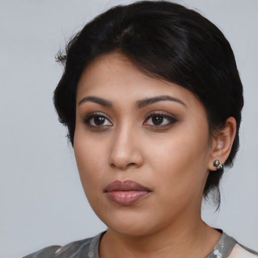 Neutral latino young-adult female with medium  black hair and brown eyes