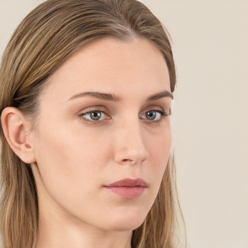 Neutral white young-adult female with long  brown hair and green eyes