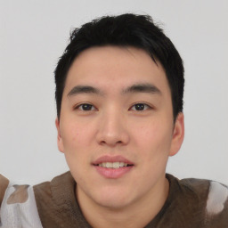 Joyful asian young-adult male with short  black hair and brown eyes