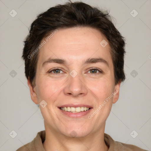 Joyful white adult female with short  brown hair and grey eyes