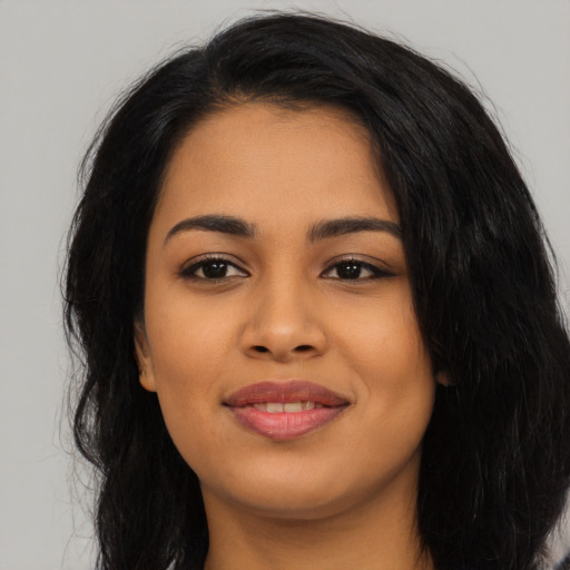 Joyful asian young-adult female with long  black hair and brown eyes