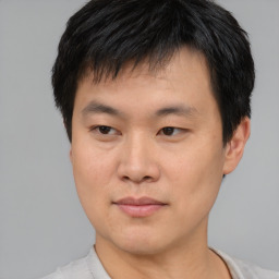 Neutral asian young-adult male with short  brown hair and brown eyes