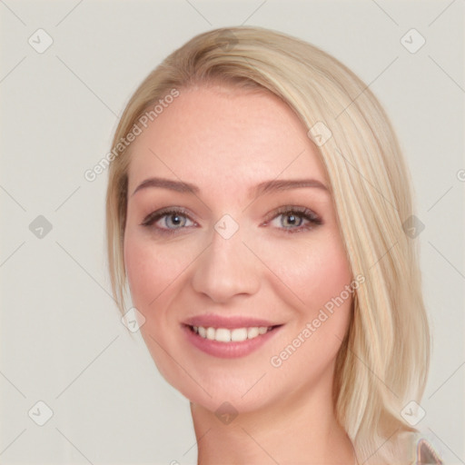 Joyful white young-adult female with long  brown hair and blue eyes