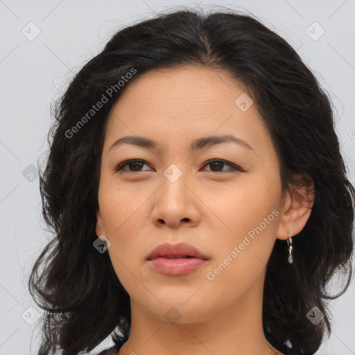 Joyful asian young-adult female with long  brown hair and brown eyes