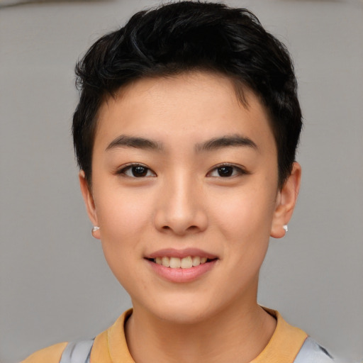 Joyful asian young-adult female with short  brown hair and brown eyes