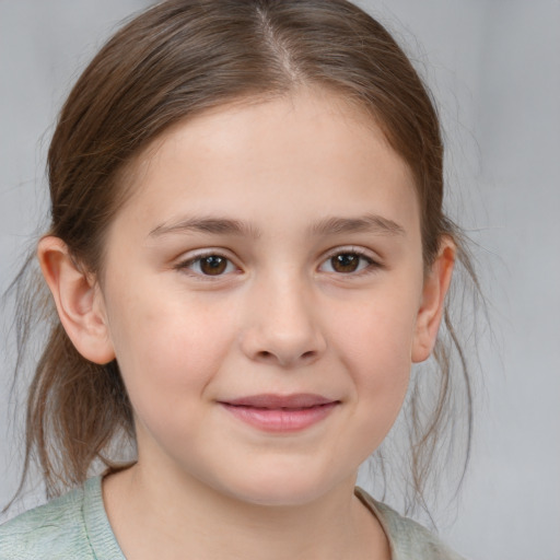 Joyful white child female with medium  brown hair and brown eyes