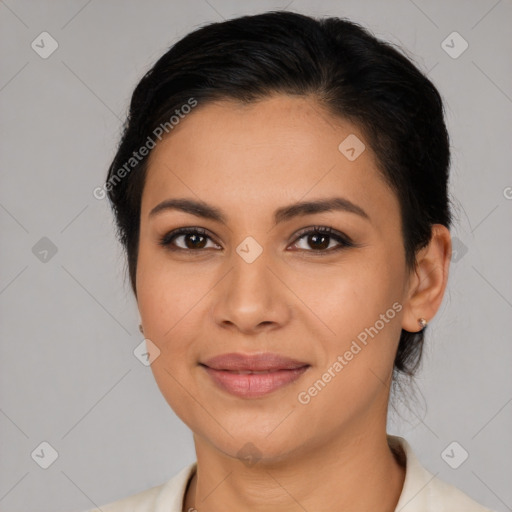 Joyful latino young-adult female with medium  brown hair and brown eyes