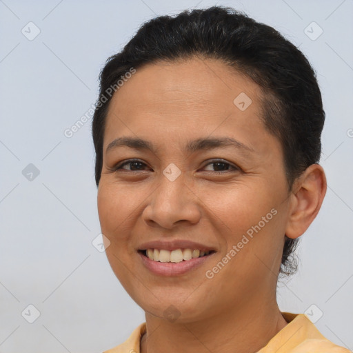 Joyful latino young-adult female with short  brown hair and brown eyes