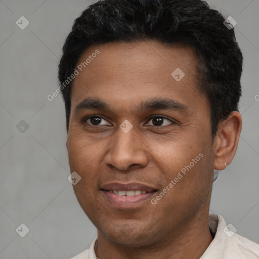 Joyful latino young-adult male with short  brown hair and brown eyes