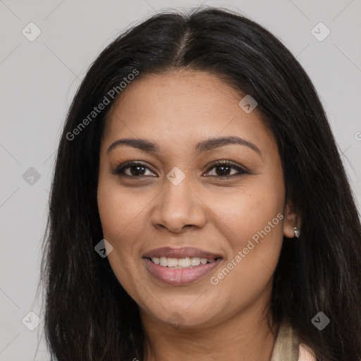Joyful latino young-adult female with long  brown hair and brown eyes