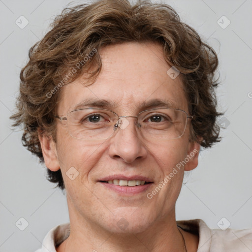 Joyful white adult male with short  brown hair and blue eyes