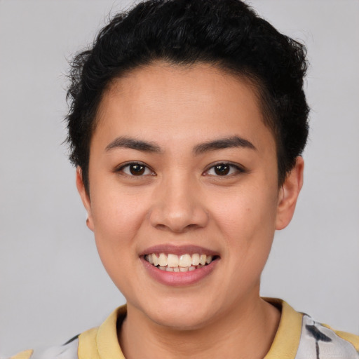 Joyful latino young-adult female with short  black hair and brown eyes