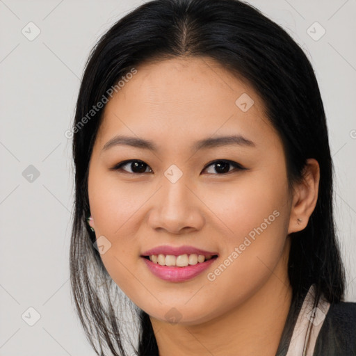 Joyful asian young-adult female with long  brown hair and brown eyes