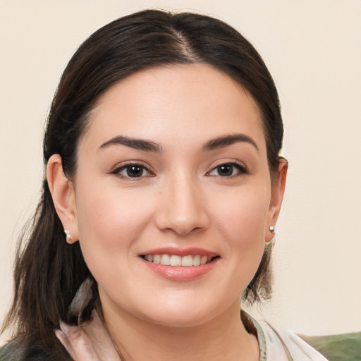 Joyful white young-adult female with medium  brown hair and brown eyes