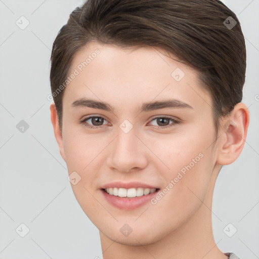 Joyful white young-adult female with short  brown hair and brown eyes