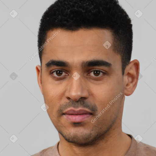 Neutral latino young-adult male with short  black hair and brown eyes