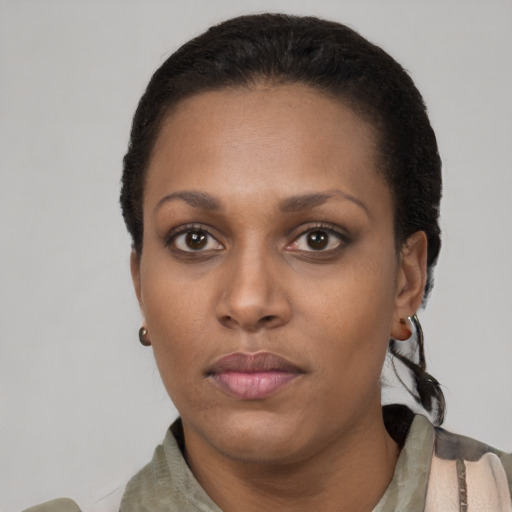 Neutral black young-adult female with short  black hair and brown eyes