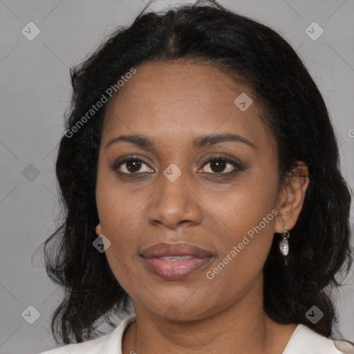 Joyful latino adult female with long  brown hair and brown eyes