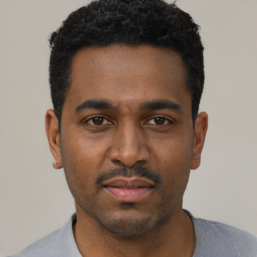 Neutral black young-adult male with short  black hair and brown eyes